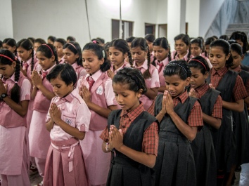 Girls start the day with a prayer at the Veerni Institute in Jodhpur, India. It's a boarding school where nearly half the students are child brides.